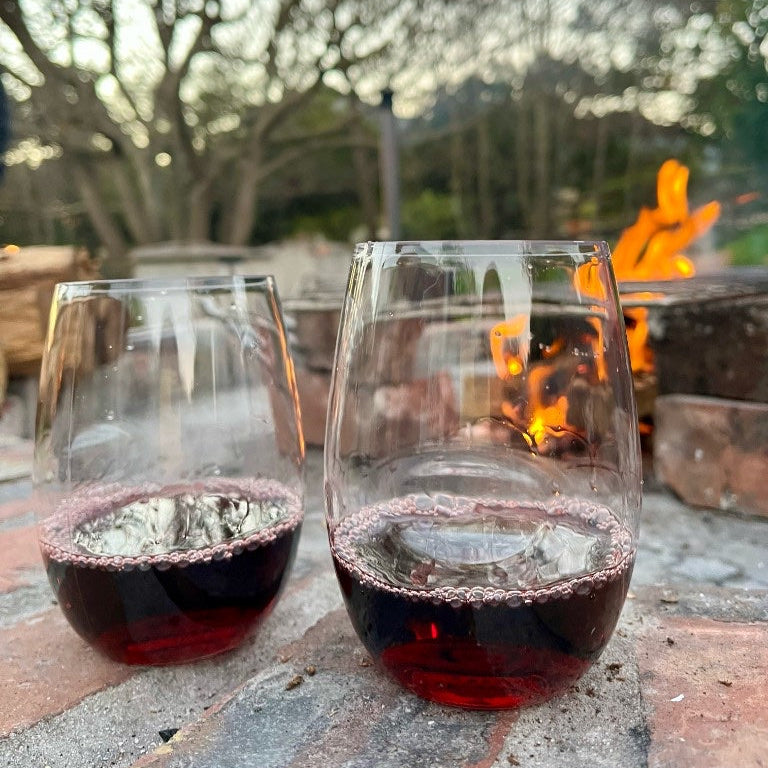 The Nightcap — shatterproof wine glasses by an outdoor fire pit